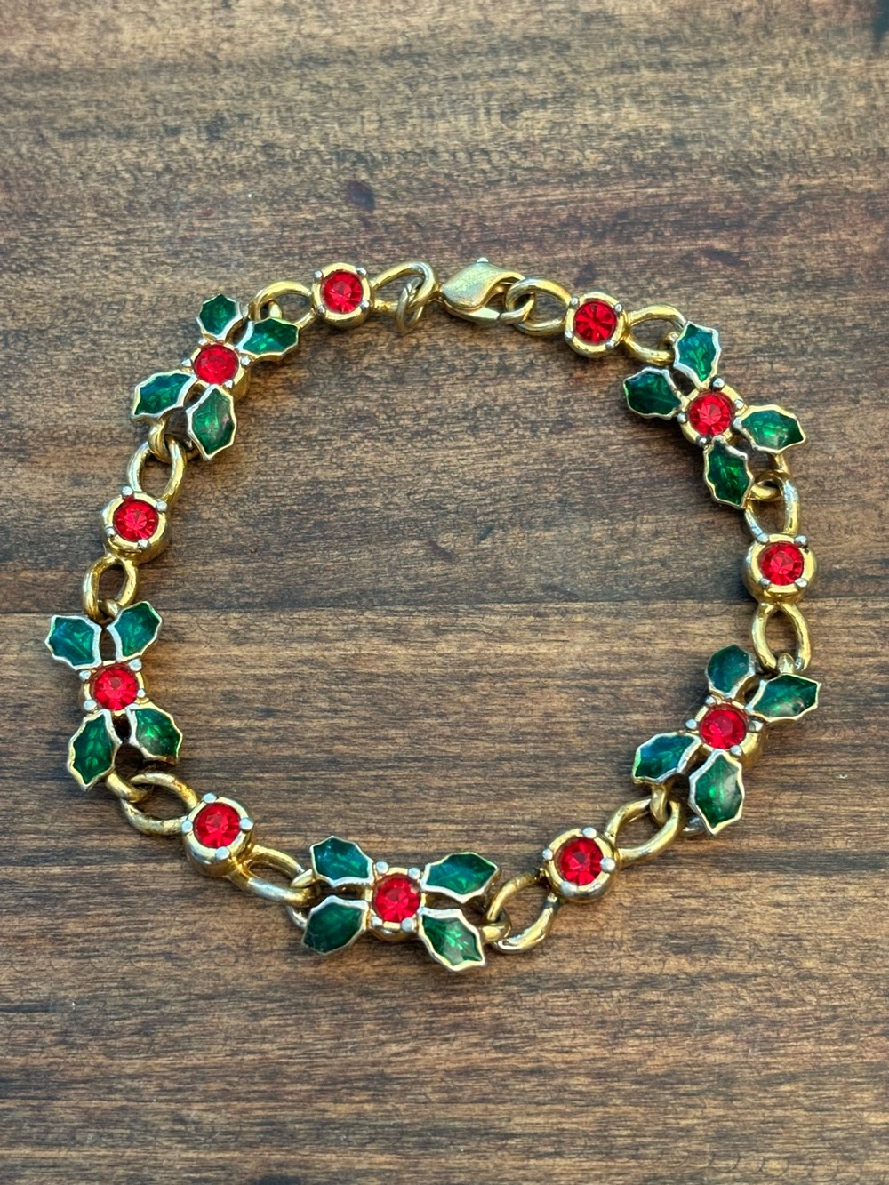 Vintage Avon Gold Tone Holly Bracelet with Green Enamel Leaves and Red Stones